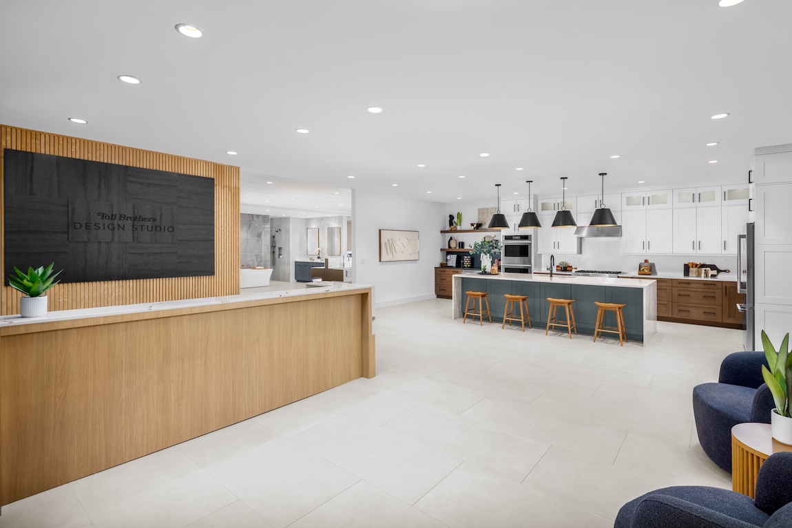 Toll Brothers Design Studio featuring a contemporary kitchen display, reception area, and curated home design selections.
