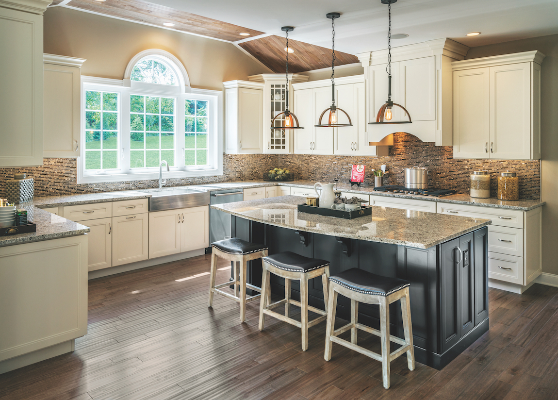 A Toll Brothers kitchen with unique kitchen lighting.