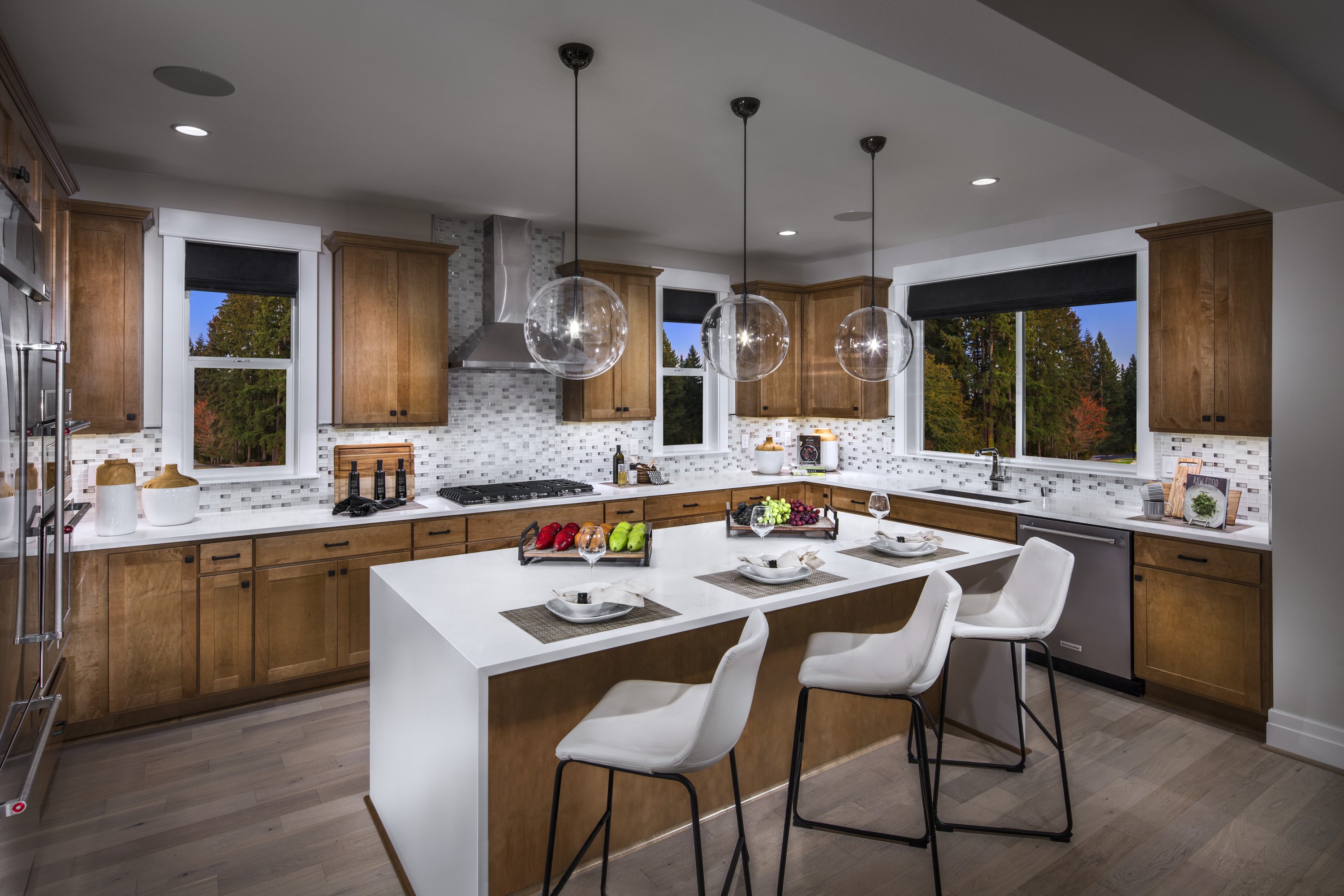 Kitchen with wood cabinets and white countertops.