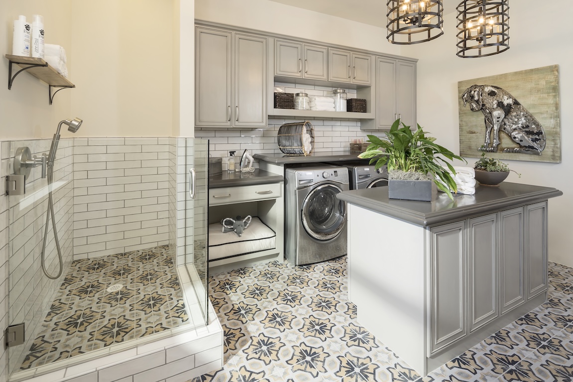 laundry room with a built-in dog bed and dog washing station