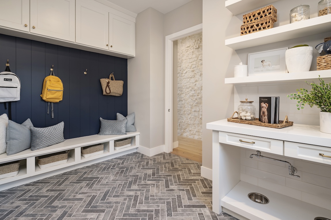 mudroom with dog bowl filling station and built-in storage