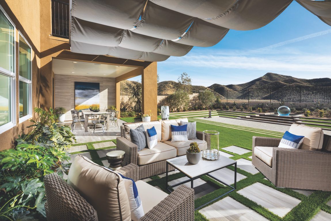 Backyard of a house facing mountains.