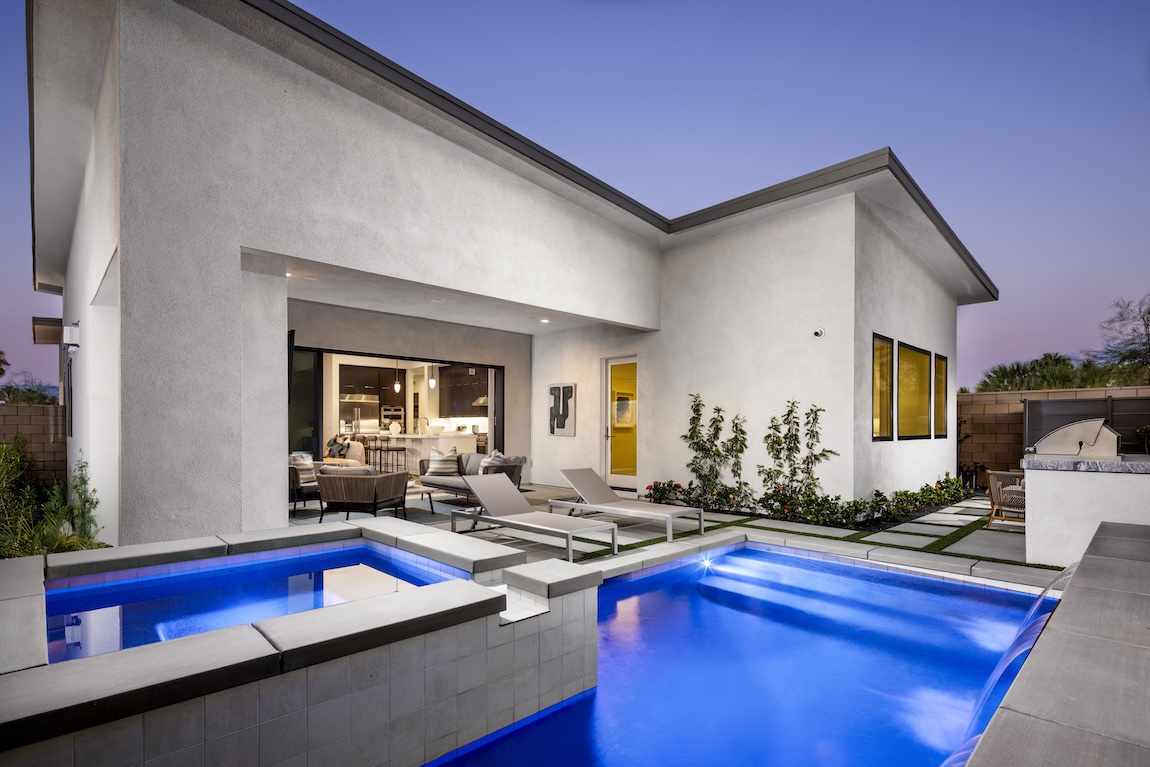 backyard pool with colorful light features