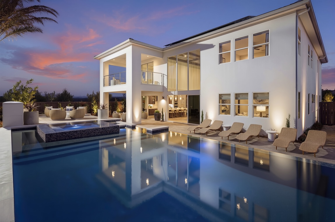 exterior of home with luxury pool and seating