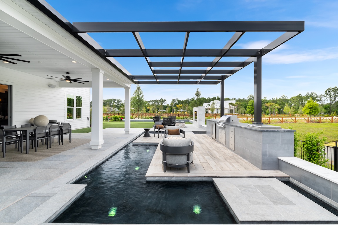backyard pool with floating kitchen space.