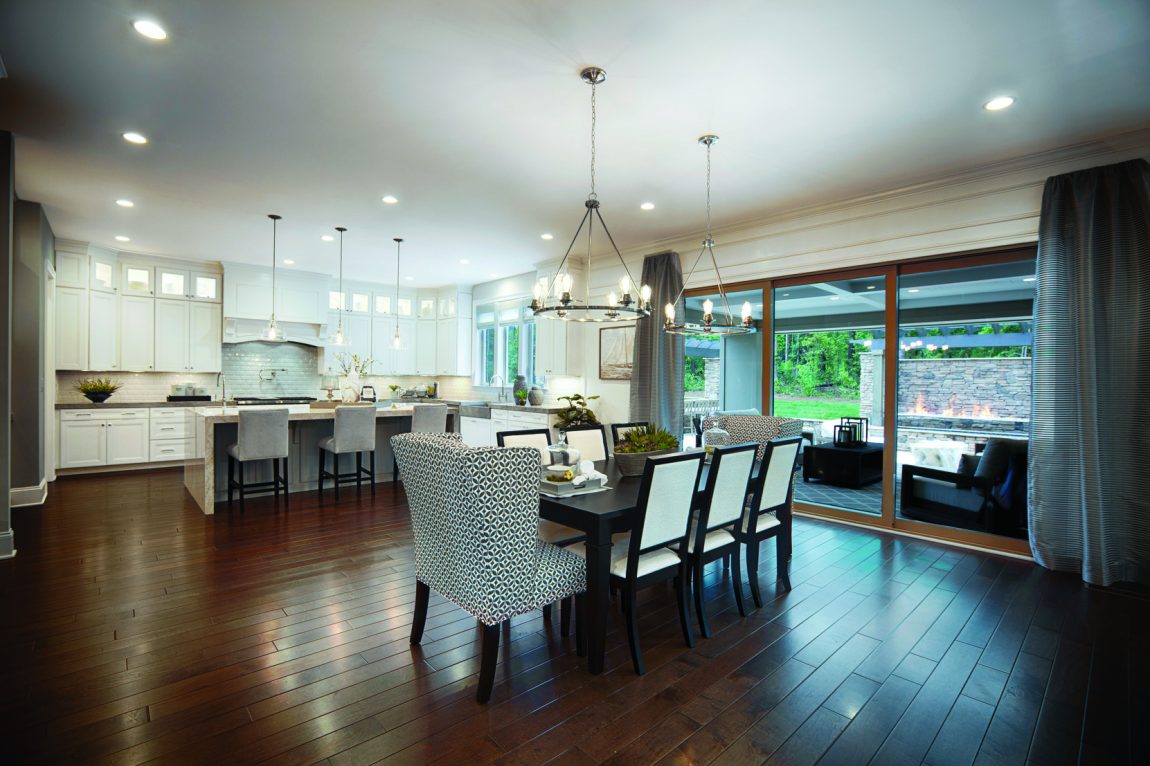 Open-concept kitchen connecting to dining area.