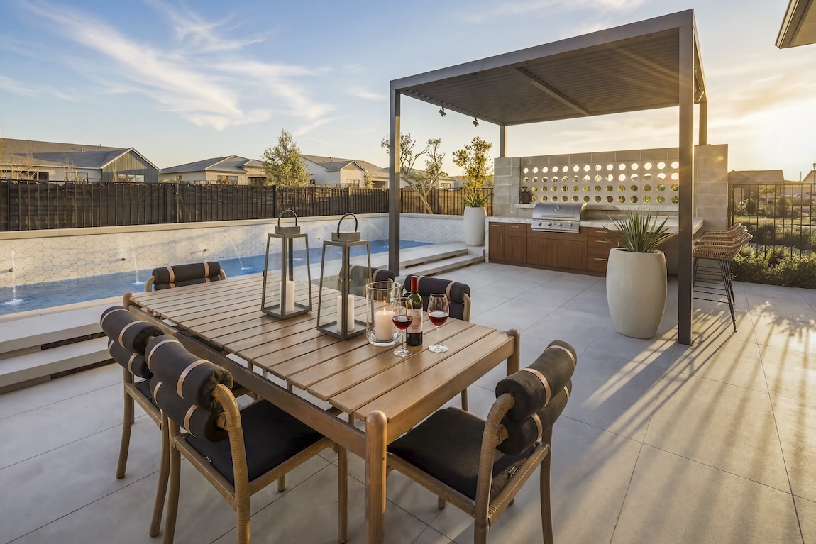 outdoor dining space next to a pool