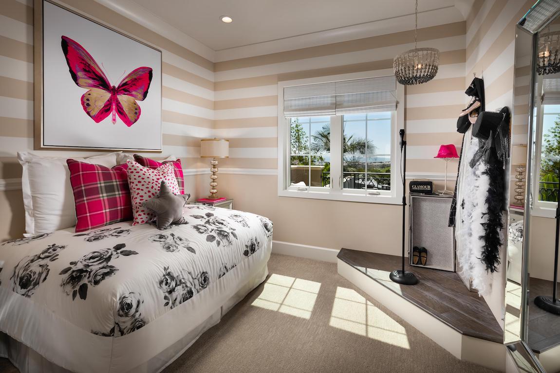 Teen room featuring pink accents and a corner stage for performative activities