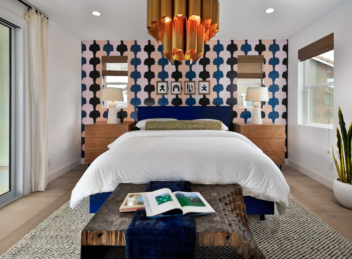 Teen bedroom showcasing exciting chandelier and eye-catching wallpaper design