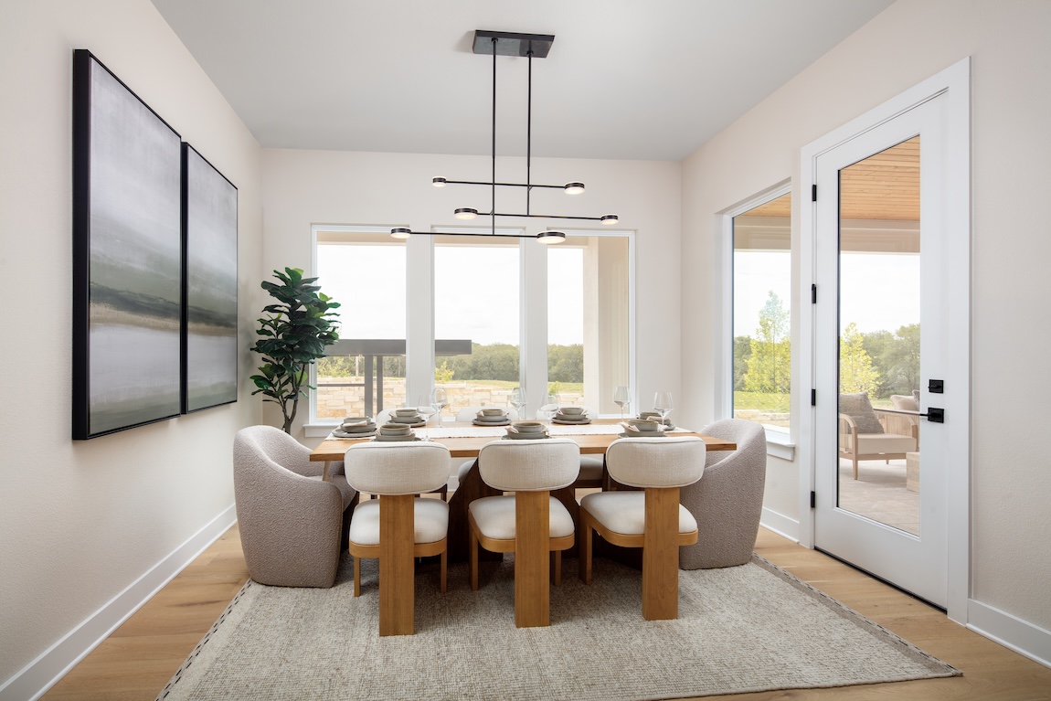 dining room with different chairs and natural light