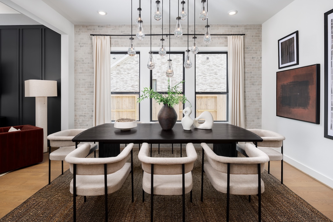 dining room with stone wall