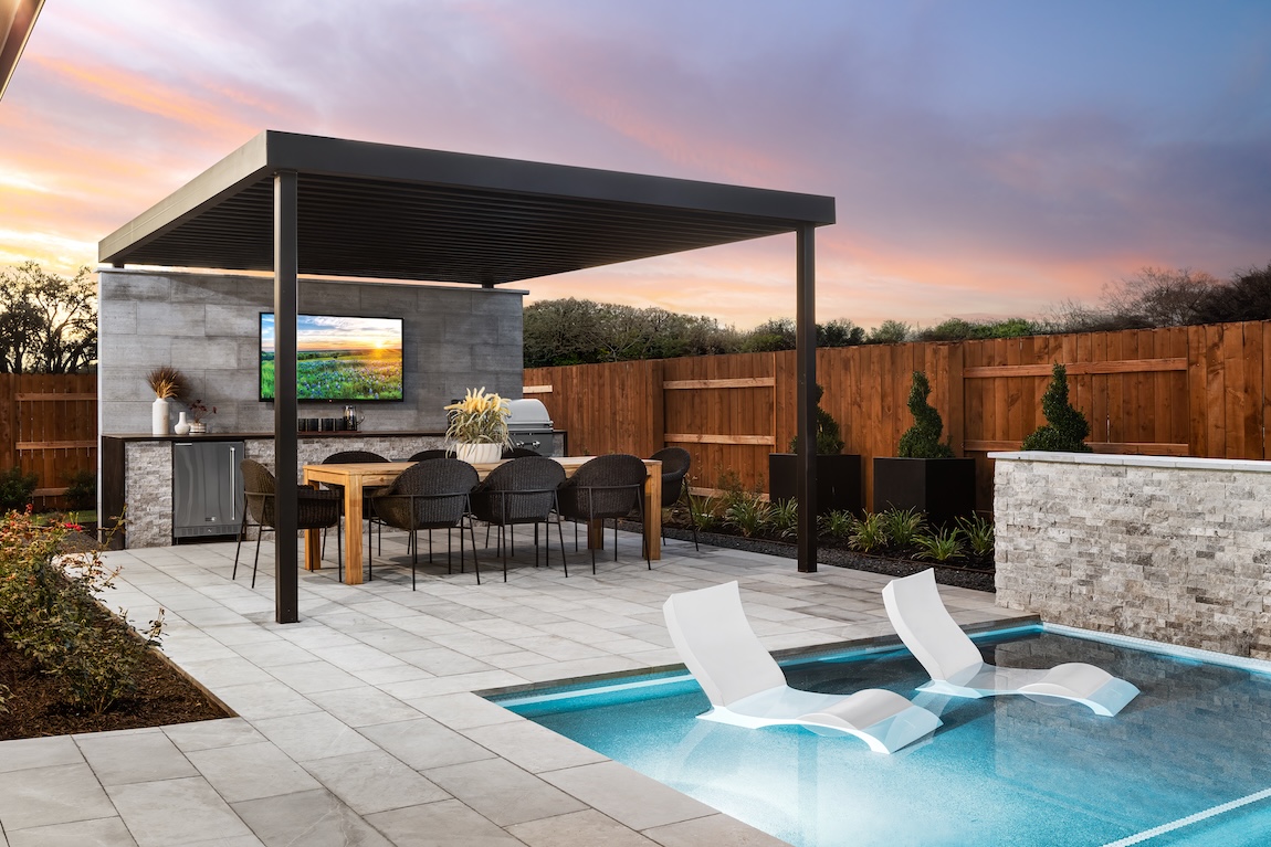 pergola with outdoor seating and kitchen