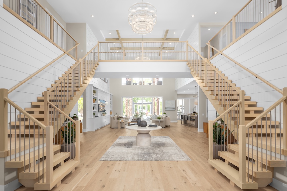 modern home with wooden staircases and shiplap walls