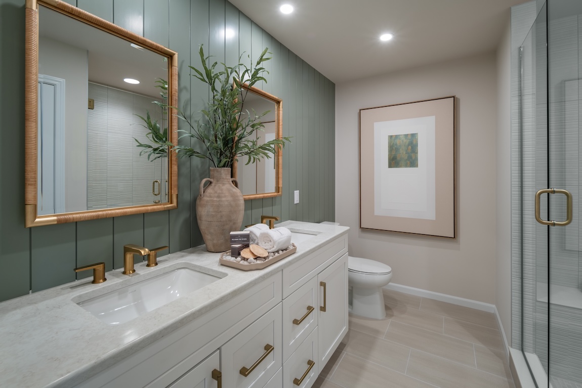 bathroom with green shiplap accent wall
