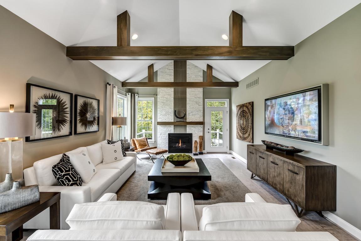 Great room featuring barn ceiling, a timeless architectural design