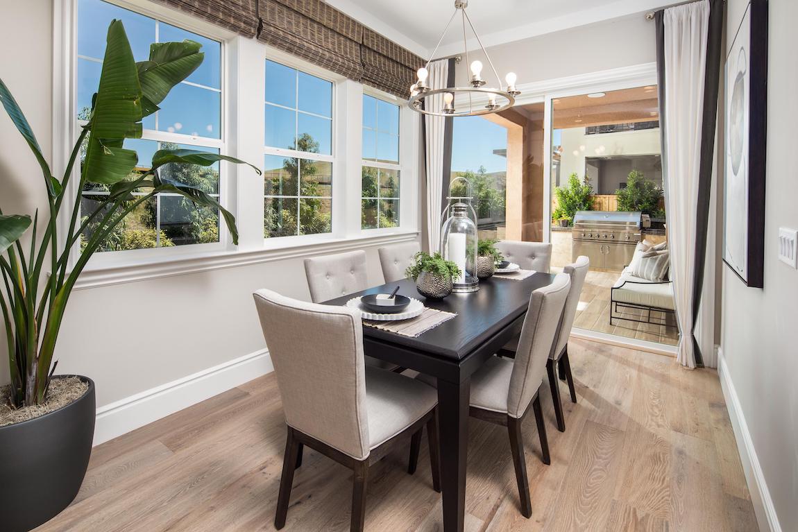 Dining room featuring natural elements such as wood flooring and plants