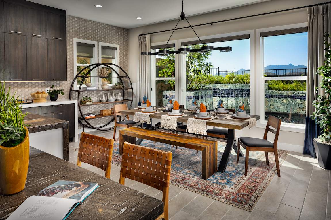 Dining space in kitchen with view and boho chic carpet.