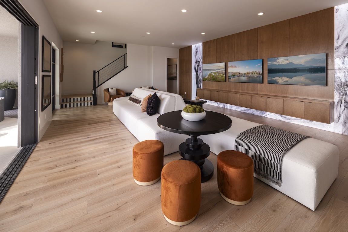 entertainment room with bold accent wall and lighting features