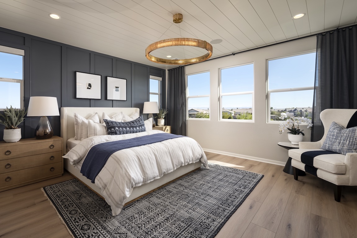 bedroom with navy accent wall and intriguing decor