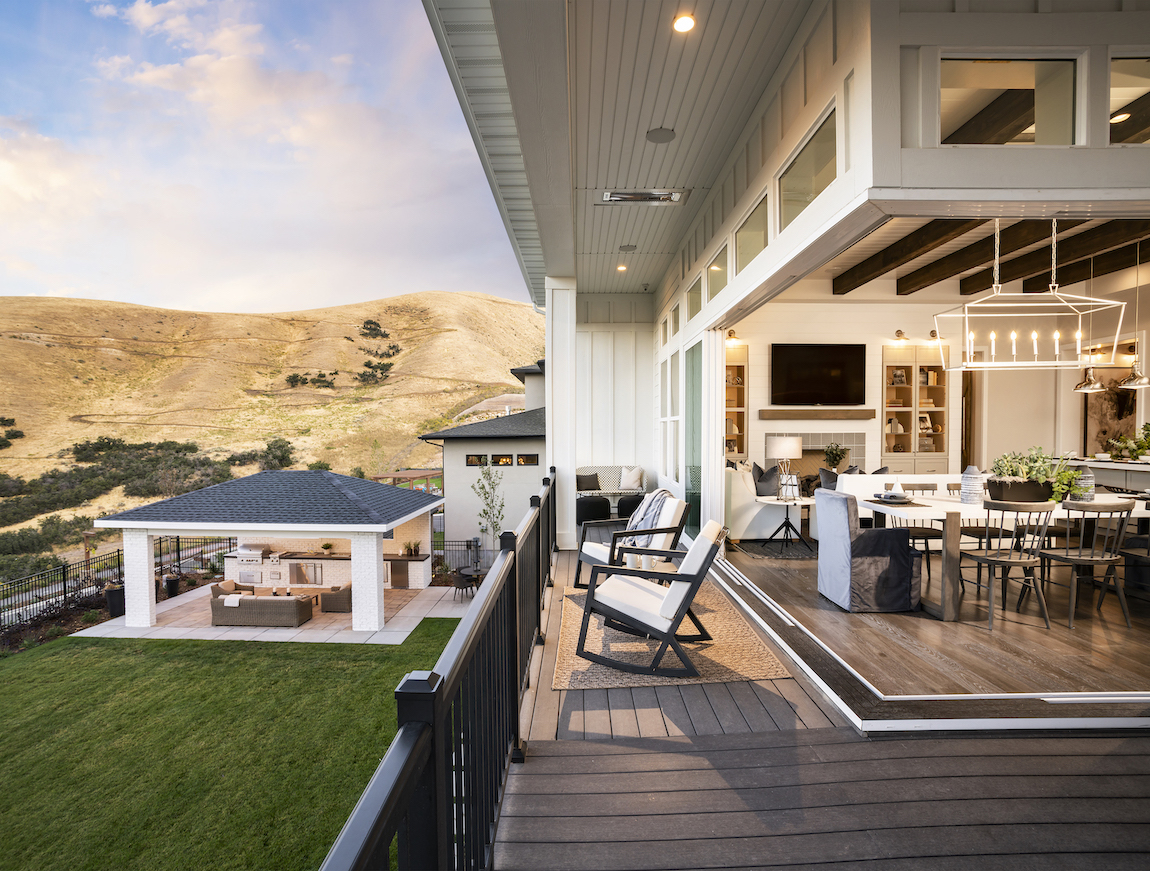 Great room with sliding doors that open up to balcony overlooking backyard.