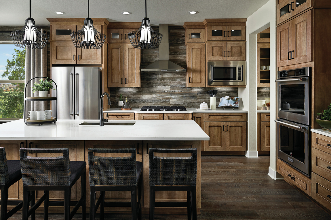 Deluxe kitchen which ample cabinetry and stunning backsplash texture