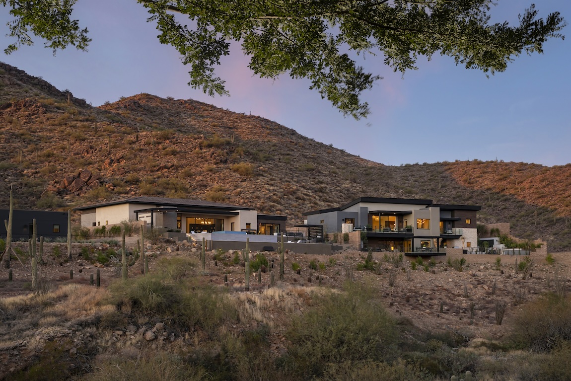 exterior of homes nestled in the mountains