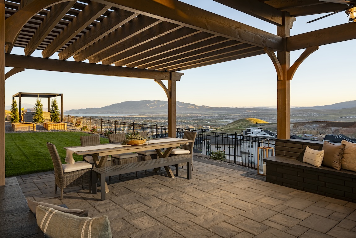 outdoor living area with seating under a wooden pergola