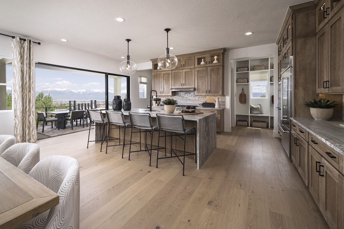 modern kitchen with wooden cabinetry and views of the outdoors