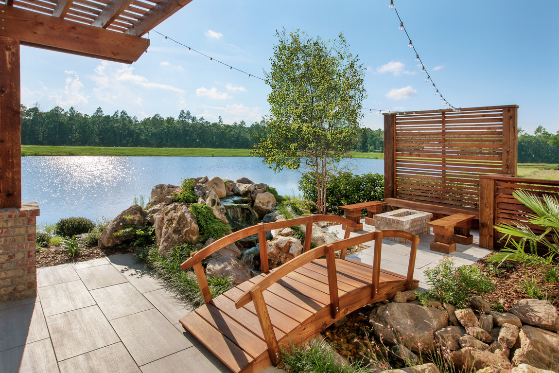 Backyard area with luxe bridge and hardscape