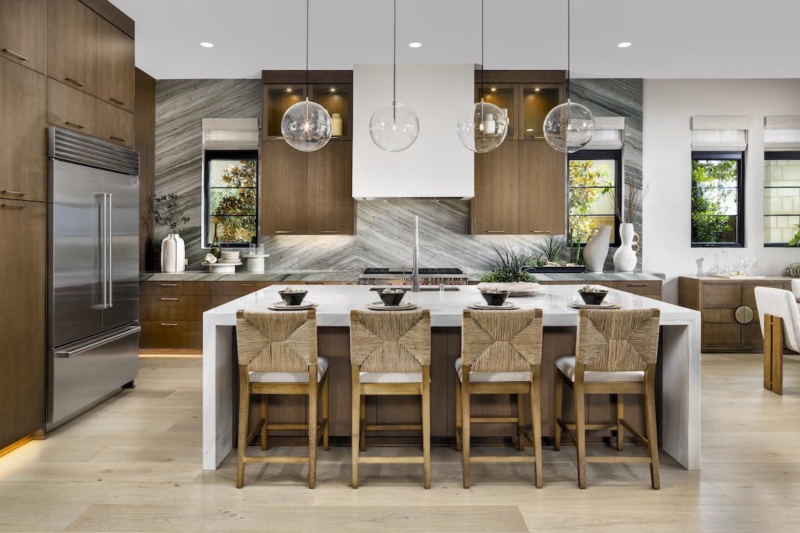 modern kitchen with wood cabinetry and waterfall island