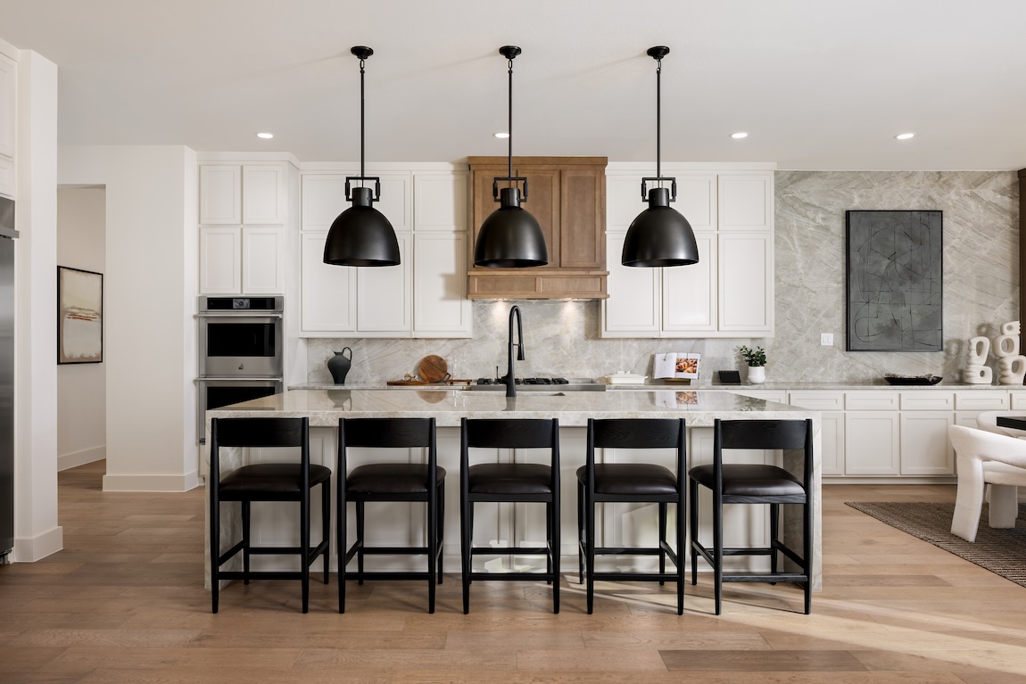 kitchen with waterfall island and black features
