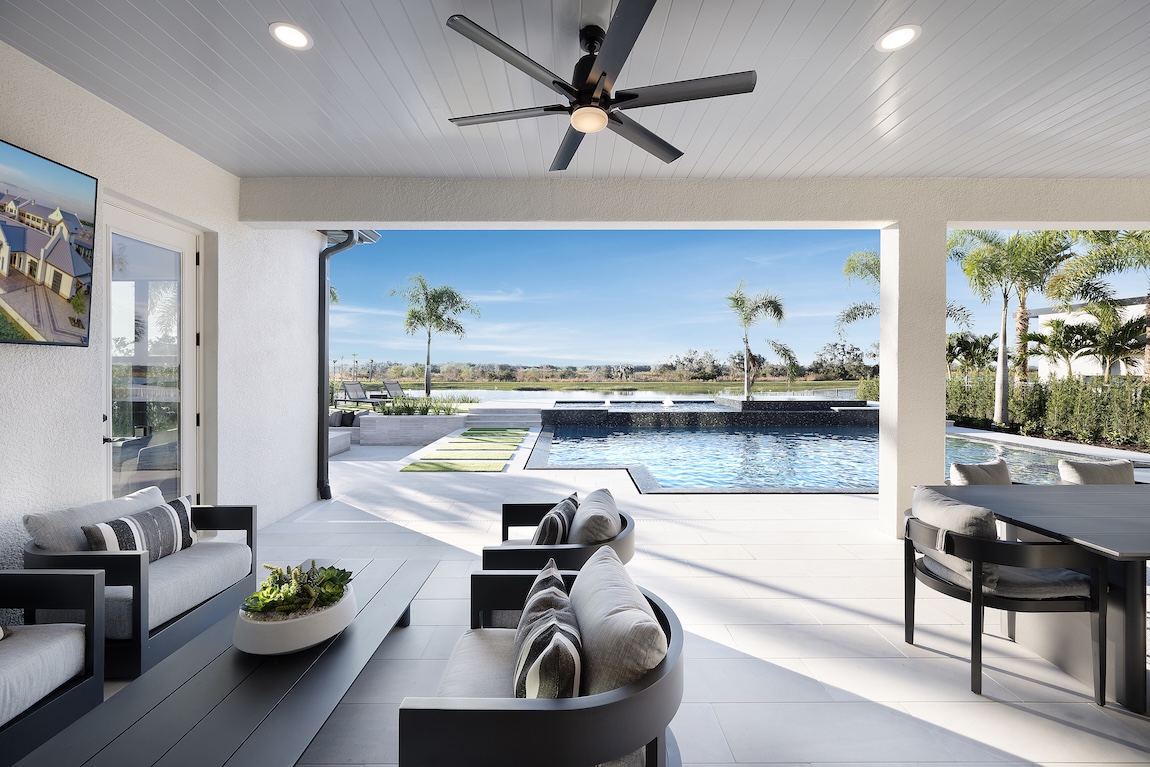 outdoor dining space with views of the water