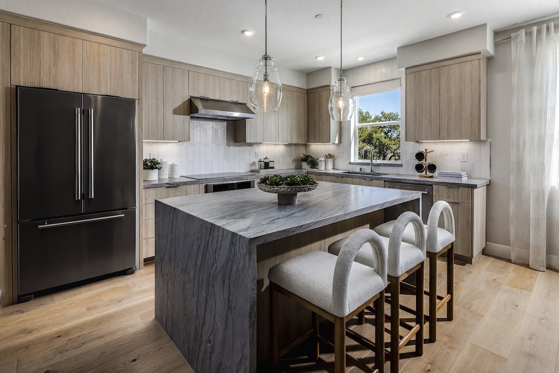 kitchen with waterfall island and seating for three