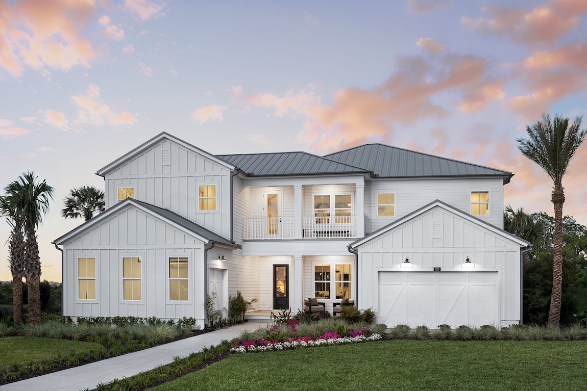 coastal exterior of home with flowers and greenery