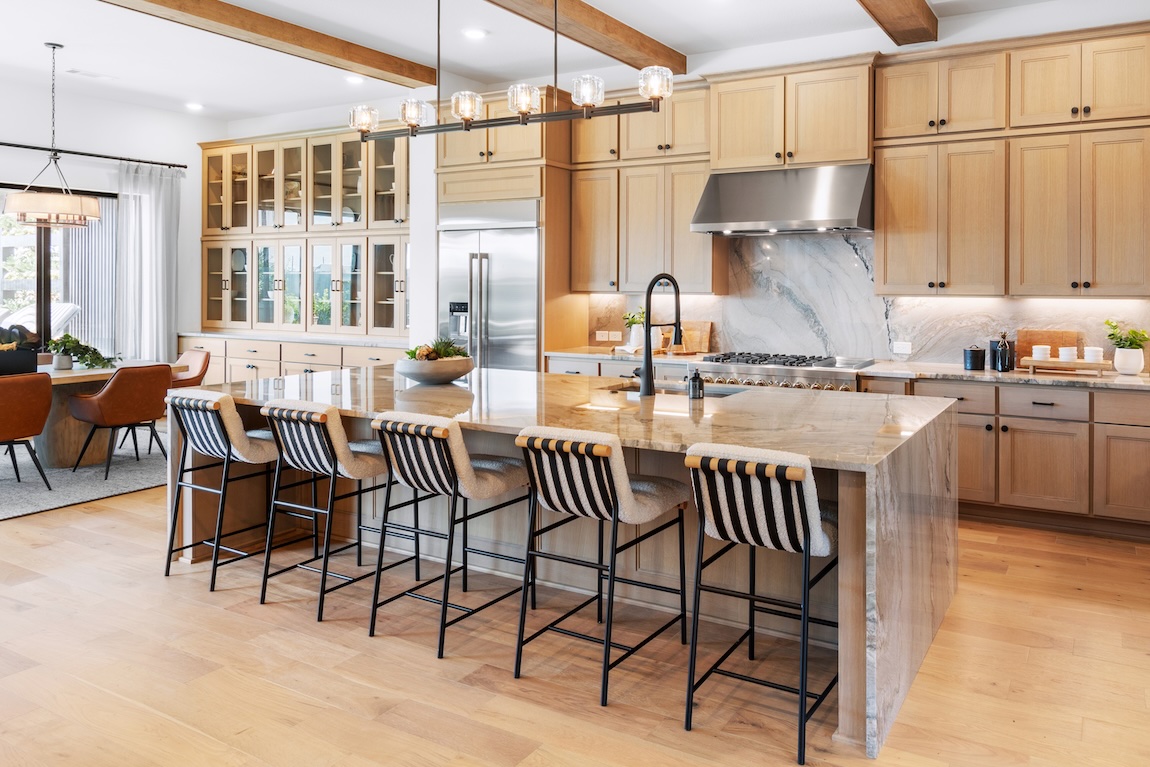 kitchen with wood cabinetry and steel hood