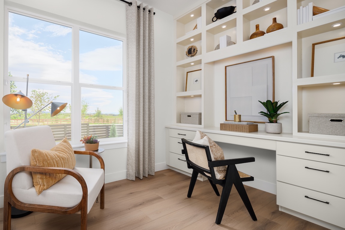 light, airy study space featuring built-in shelving