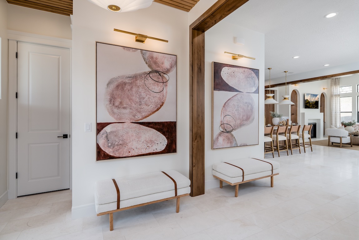 entryway with artwork and accent lighting