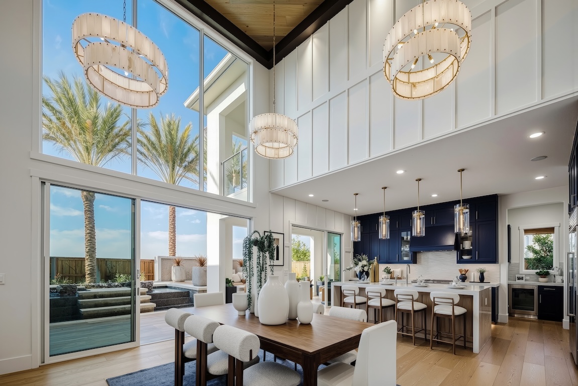 kitchen and dining space with large windows and sliding glass doors