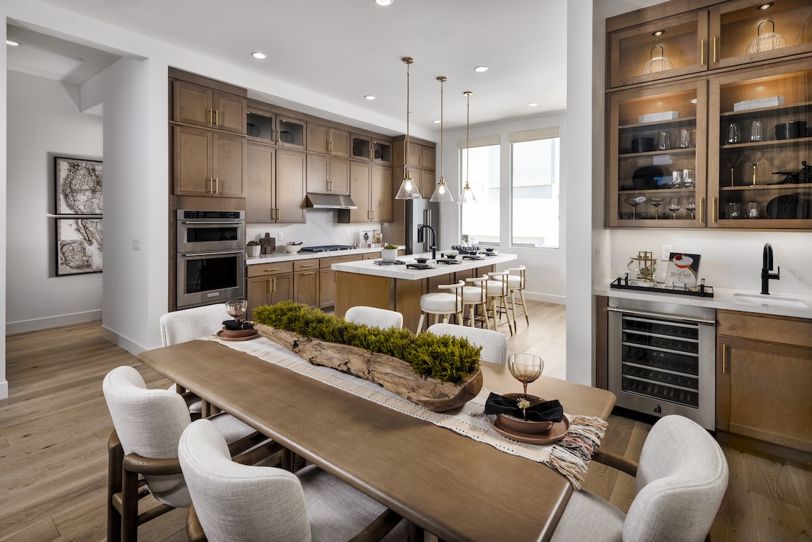 open concept kitchen and dining area with wood cabinets