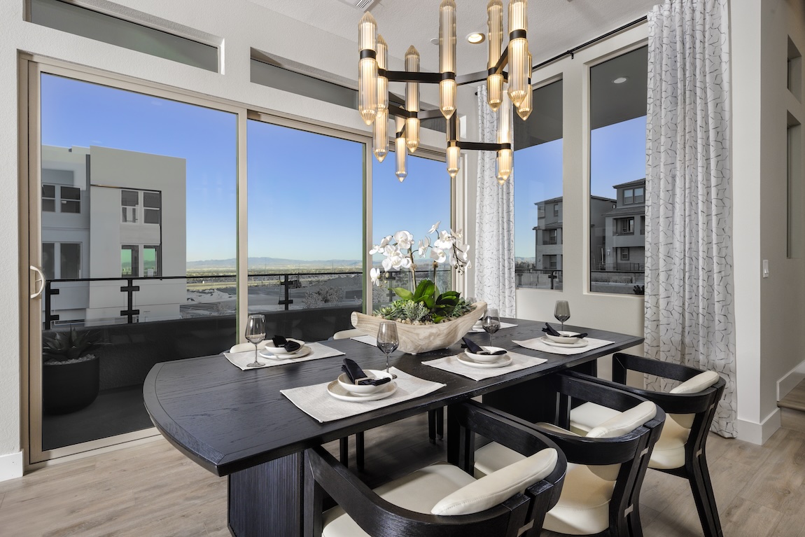 modern dining room with sliding doors leading to the outdoor patio