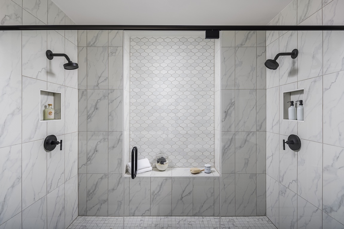 large marble shower with dual showerheads