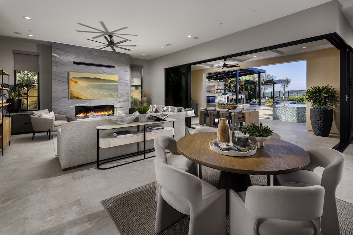 indoor-outdoor living space with dining tables