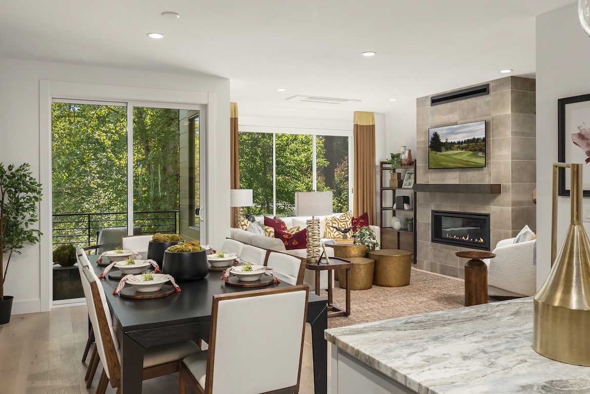 living room and dining space with a neutral color palette