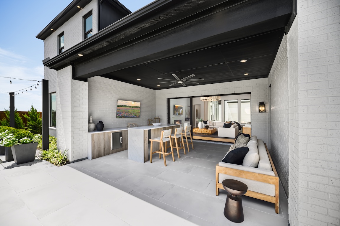 outdoor living space with couch and bar seating