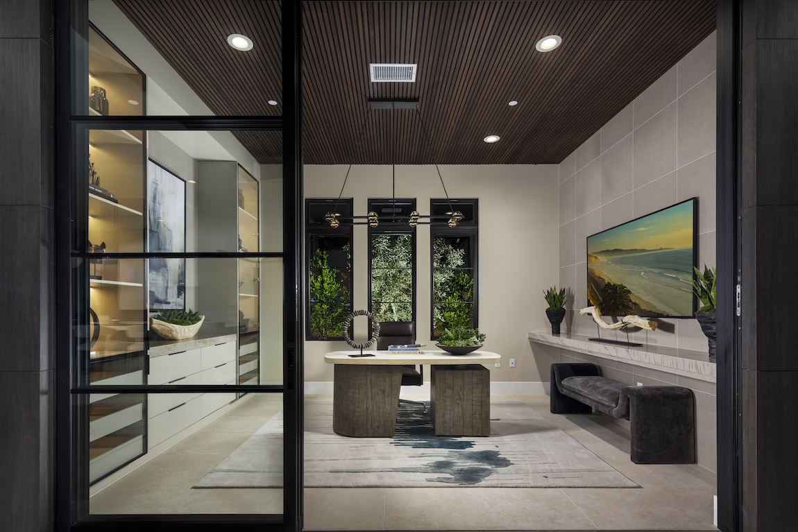 home office with glass doors and ample storage space