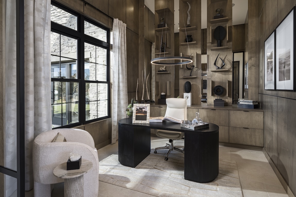 home office with large desk and overhead lighting