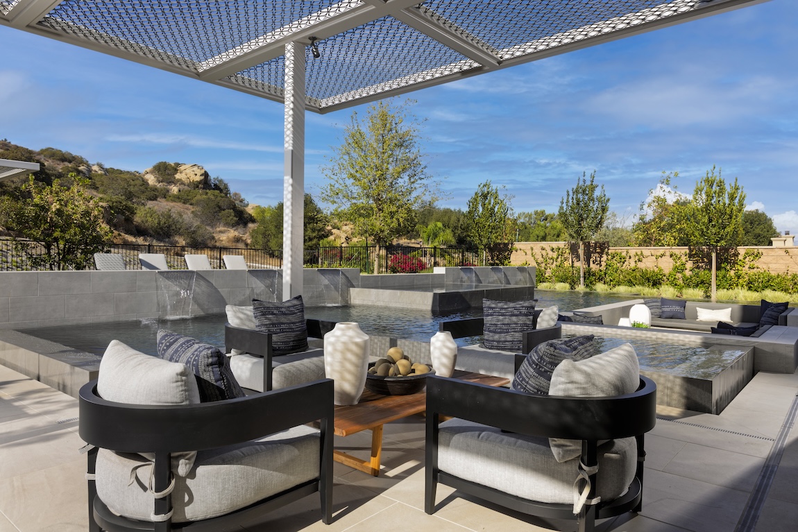 outdoor living space with seating and pool space