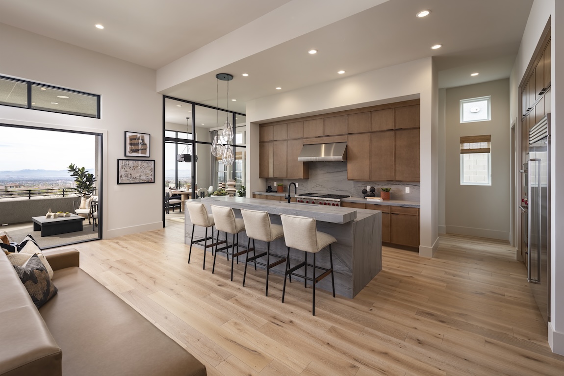 kitchen with waterfall island and wooden cabinets
