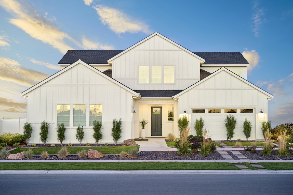 exterior of modern farmhouse with lush landscaping