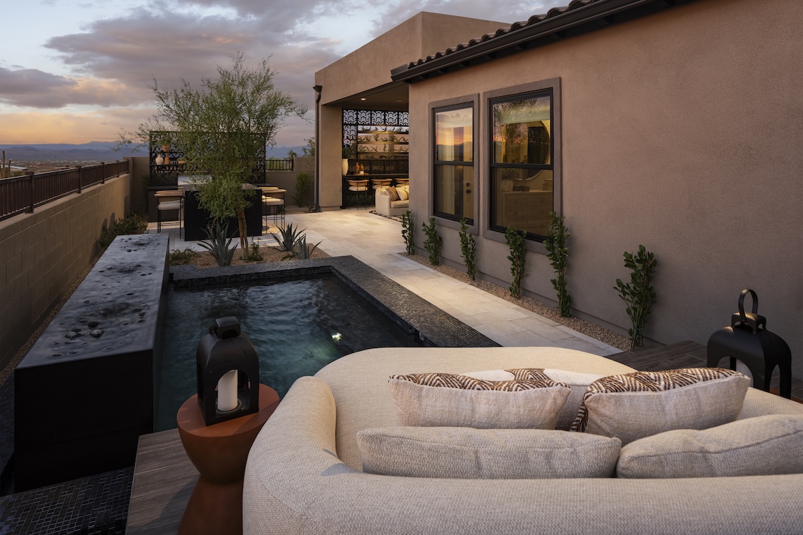 outdoor living space with small pool and comfortable chair